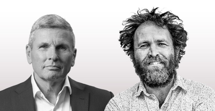 Side by side headshots of two men, one in a business suit with short hair and the other in a dress shirt with wild unruly hair