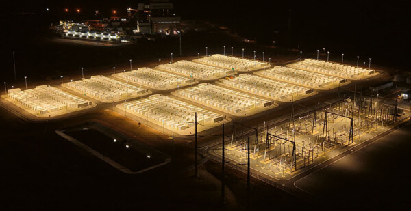 Aerial shot of big battery storage project lit up at night