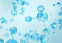 WAH₂ clean ammonia project wins Major Project Status Rendered image of blue ammonia molecules on blue background