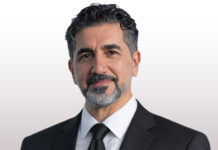 Five minutes with renewable energy innovator Dr Dia Milani Head and shoulders shot of smiling man wearing a black suit and a tie