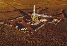 SA Govt cops backlash over proposed fracking ban lift Aerial shot of hydraulic fracture equipment in arid outback region