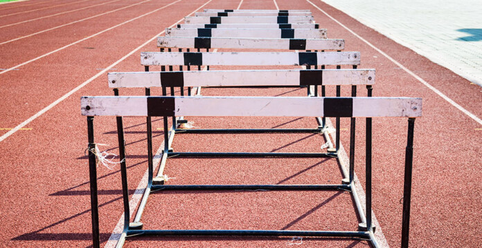 hurdles Close-up shot of hurdles set up on a red running track