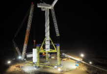 Nabrawind completes “crane-less” turbine install in extreme wind Crane-less wind turbine installation system lit up by lighting at night