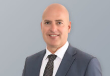 Dean Nalder appointed chair of AVESS Energy Head and shoulders shot of a smiling male executive wearing a suit and tie