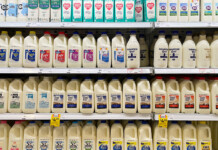 “More like milk”: AEMC to simplify electricity pricing Photo of different milk bottle brands and types in an Australian supermarket refrigerator