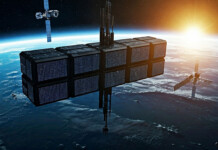 Instead of building data centres on Earth, what about space? Rendered image of a orbital data centre surrounded by satellites above Earth
