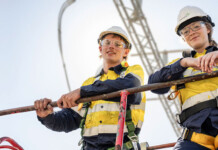 Applications open for Transgrid’s 2027 Apprentice Program male and female energy workers atop structure wearing hard hats and safety gear