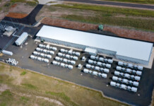 Vena Energy secures $1.4B for Aussie solar and batteries Aerial photo of battery units at a battery storage energy system surrounded by grassy landscape
