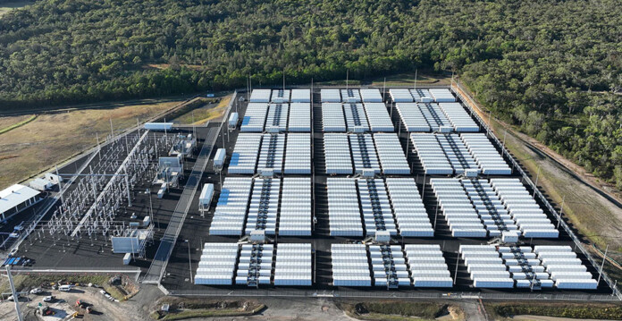 Aerial photo of large-scale battery storage project surrounded by forest
