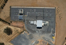 Australia’s largest synchronous condenser goes operational Aerial image of a large synchronous condenser facility in an arid landscape
