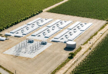Firmus secures renewable power for Aussie AI factories Rendered image of a battery energy storage system set in a rural landscape