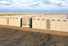 Neoen doubles Goyder Battery with two capacity contracts Image of battery storage units at a large battery project with blue sky overhead