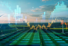 Engineering the ‘carbonless’ grid Rendered image of a digital grid landscape including renewable energy sources such as wind turbines