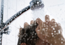 After home batteries, could the humble water heater be the next big step forward? Shower head spraying hot water on the top of a male head