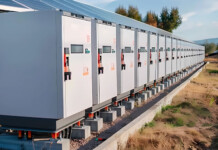 Harnessing certainty in energy infrastructure: Why pre-assembled cable systems are changing installation outcomes Battery units at an energy storage system with blue sky overhead
