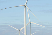 Federal approval for RWE’s 1.1GW Theodore Wind Farm Three large white wind turbines pictured against pale blue sky