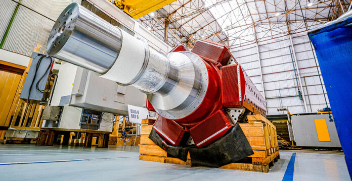 Massive synchronous condenser being assembled in a factory