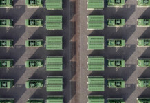 ACEnergy finalises sale of Yanco BESS project Drone shot of green battery units at a large battery storage project