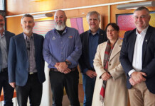 CSIRO launches Indigenous energy transition scholarship A group of executives pose for a photo in a room adorned with Indigenous artwork