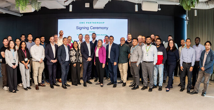 endeavour-engineers-australia Cohort of male and female engineers and executives at a partnership signing ceremony