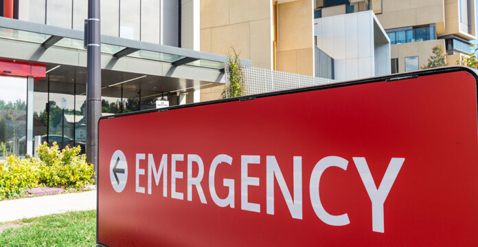 hospital-emergency Red emergency sign out the front of a modern hospital in Australia