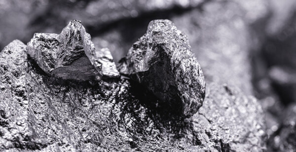 Close up of silvery rock that is the rare earth mineral Scandium