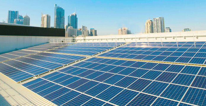 Existing solar panels on the roof of the ICC Sydney with CBD buildings in background