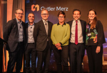 Bright minds discuss data centre network integration Six male and female energy experts on stage at a Cutler Merz event