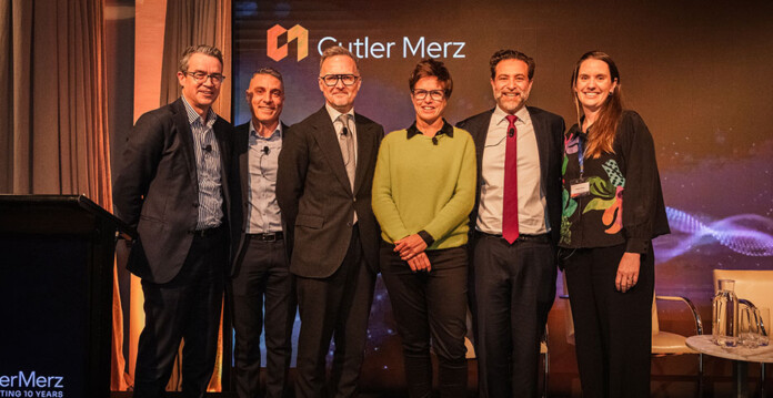 cutler-merz Six male and female energy experts on stage at a Cutler Merz event