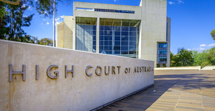 External shot of Australia's High Court with blue sky overhead