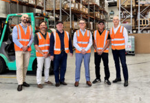 Zenith inks deal with Traditional Owners in Goldfields Group of male executives from MGAC and Zenith Energy pose for photo in warehouse