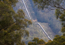 Hydro Tas completes Poatina Power Station upgrade Stage 1 Aerial photograph of long penstock pipe running down hillside